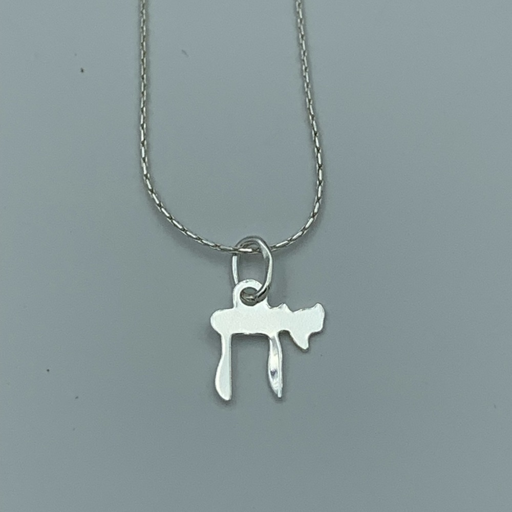 Sterling “Chia” symbol necklace